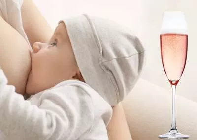 Darf man Alkohol in der Stillzeit trinken? Baby wird gestillt, Sektglas.